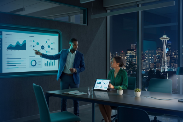 An IT consultant reviewing a strategic technology roadmap with a business owner, highlighting vCIO services Seattle.